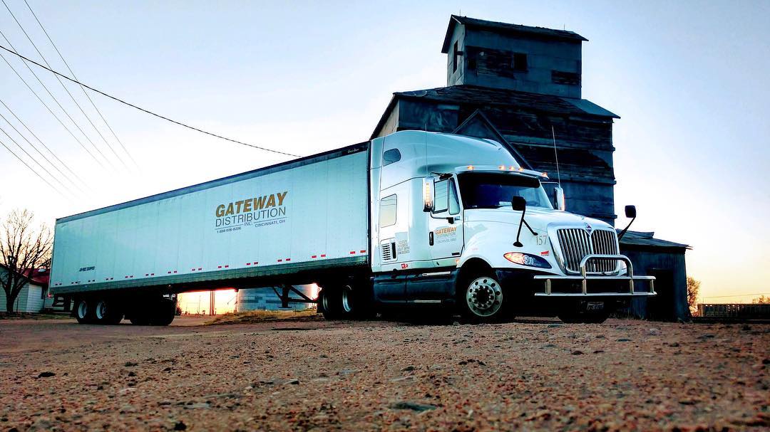 Transport flag poles and light poles safely with specialized trucking equipment designed for poles.